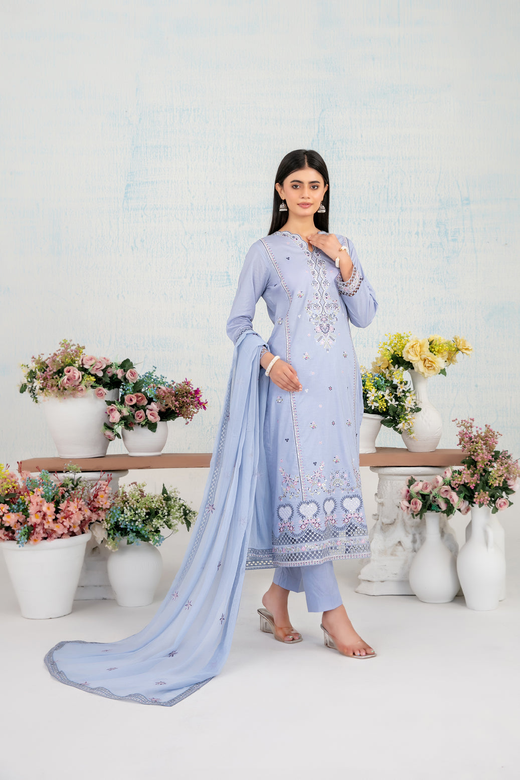 Ice blue embroidered lawn shirt and chiffon dupatta by Tawakkal Fabrics D-4116 with white flower pots in background